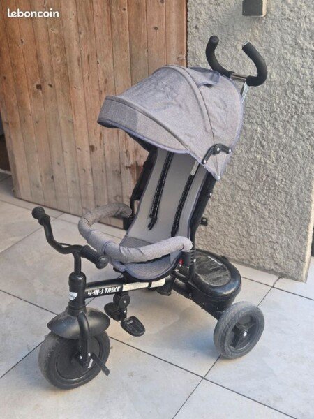 Tricycle pour Bébé Besney. Equipé d'une ceinture de sécurité et d'une boite de rangement à l'arrière du tricycle . Prix indiqué est pour 1/2 journée (5€ pour 1/2 journée) image